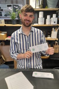 Thomas Tyrrell with tickets for Prestwood Big Week History evening